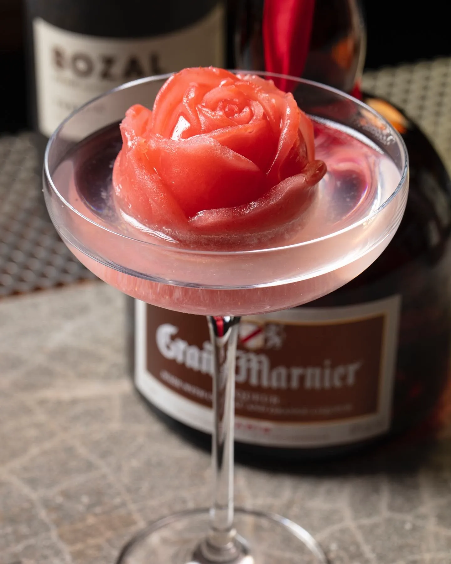 The Every Rose Has Its Thorn cocktail at Azabu: a pink, rose-shaped ice in a coupe glass