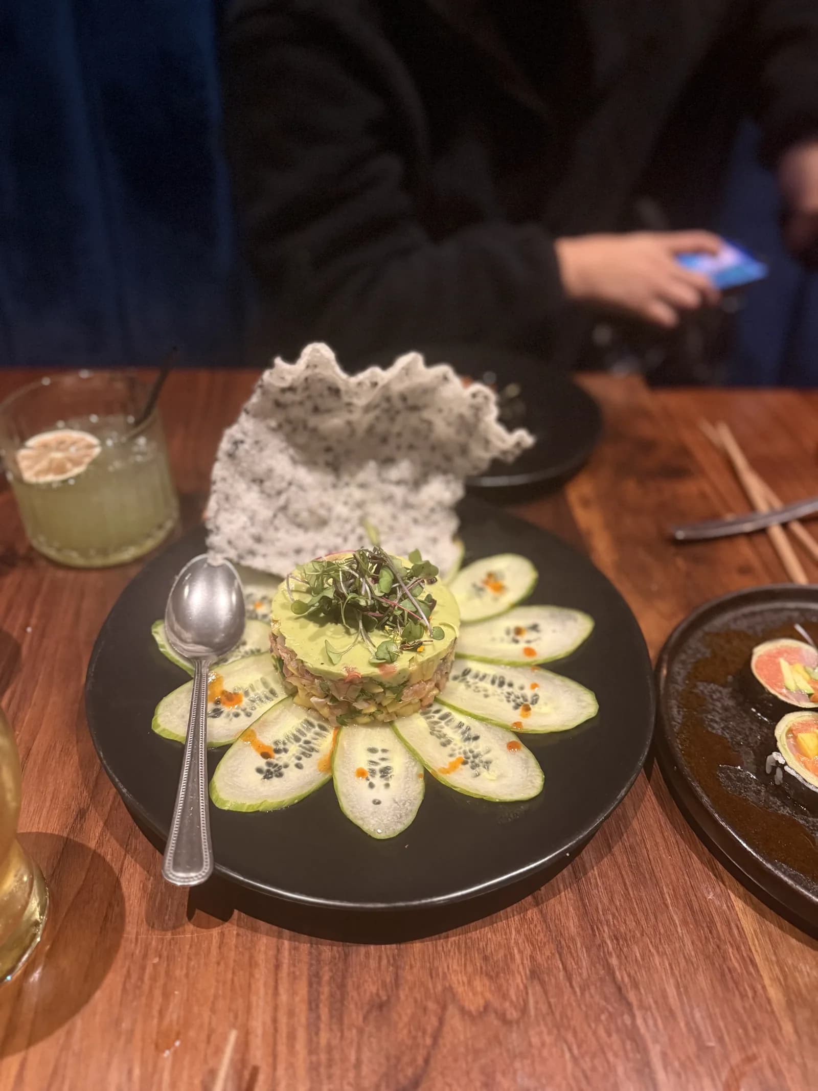 Bluefin Tuna & Scottish Salmon Tartare at Azabu: an avocado-topped tower on a ring of thin cucumber slices, with a black-sesame rice cracker