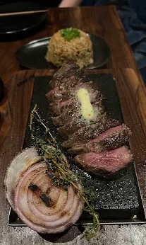 Denver Wagyu: sliced steak with butter, charred onion and fried rice