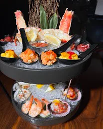 Premium Seafood Tower: a two-tier tower of crab, shrimp, oysters and more on ice