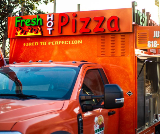 Front of the Fresh Pizza on Wheels truck, "Fired to Perfection"